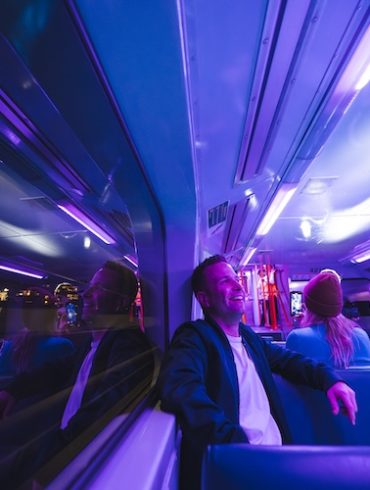 a group of people sitting in a bus